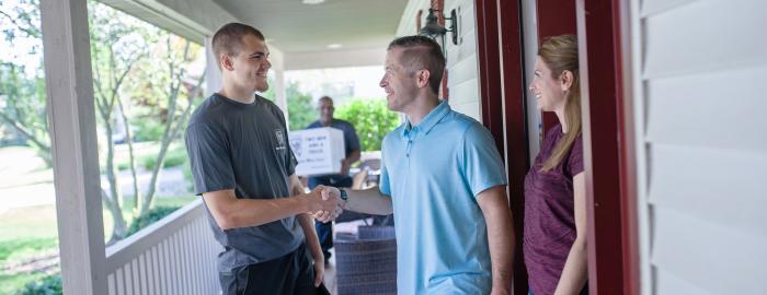 TWO MEN AND A TRUCK mover greeting customers 