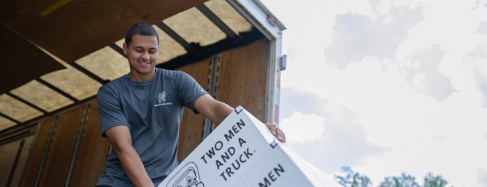 TWO MEN AND A TRUCK mover loading a moving truck 