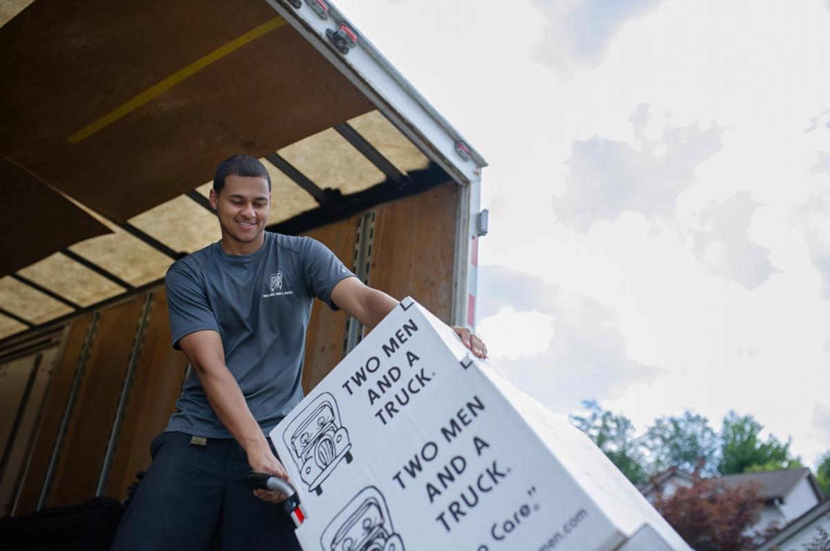 TWO MEN AND A TRUCK mover loading a moving truck 