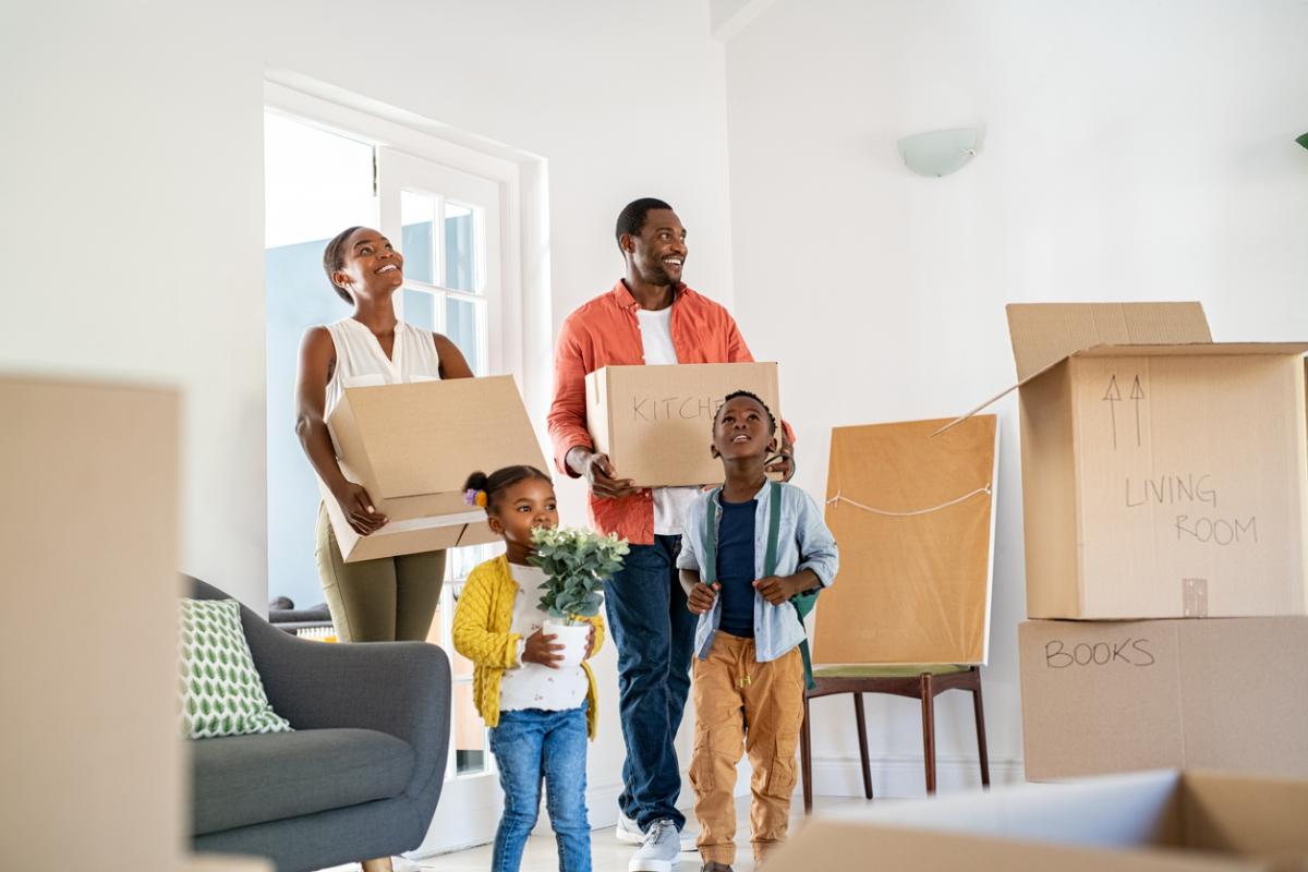 A Family Moving Into A New Home 