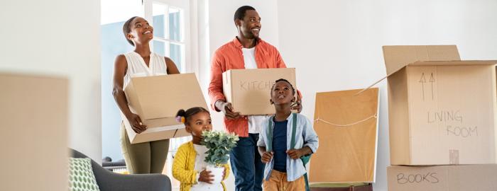 A Family Moving Into A New Home 