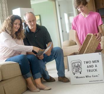 Couple viewing a moving checklist