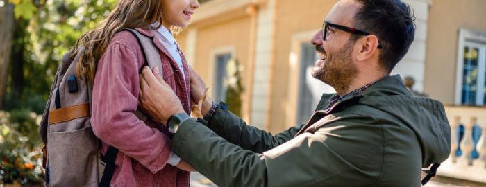 Parent helping their child prepare for a new school year 