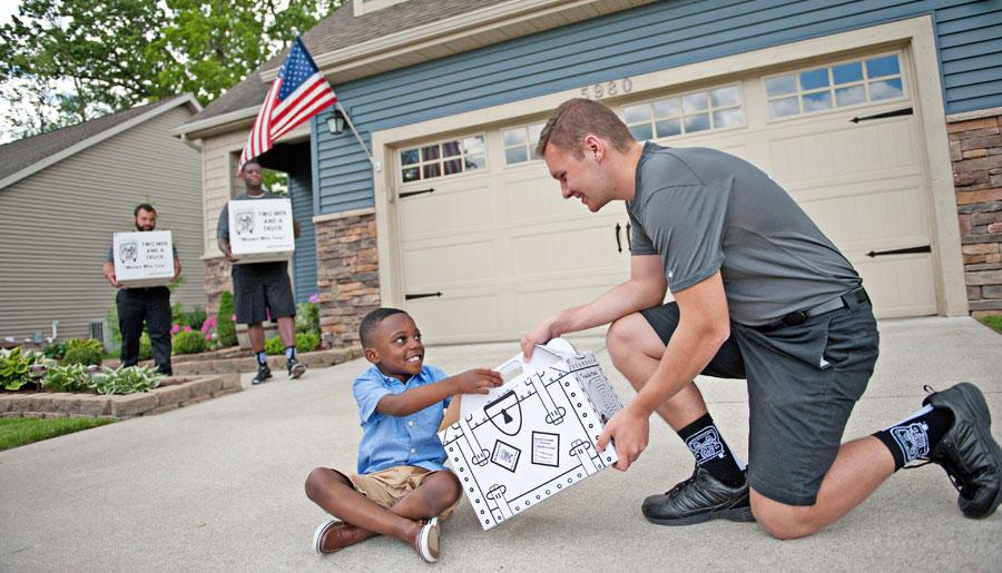 mover handing box to child