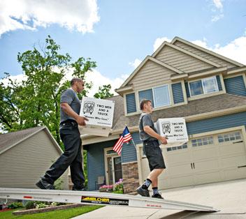 movers unloading boxes from a truck