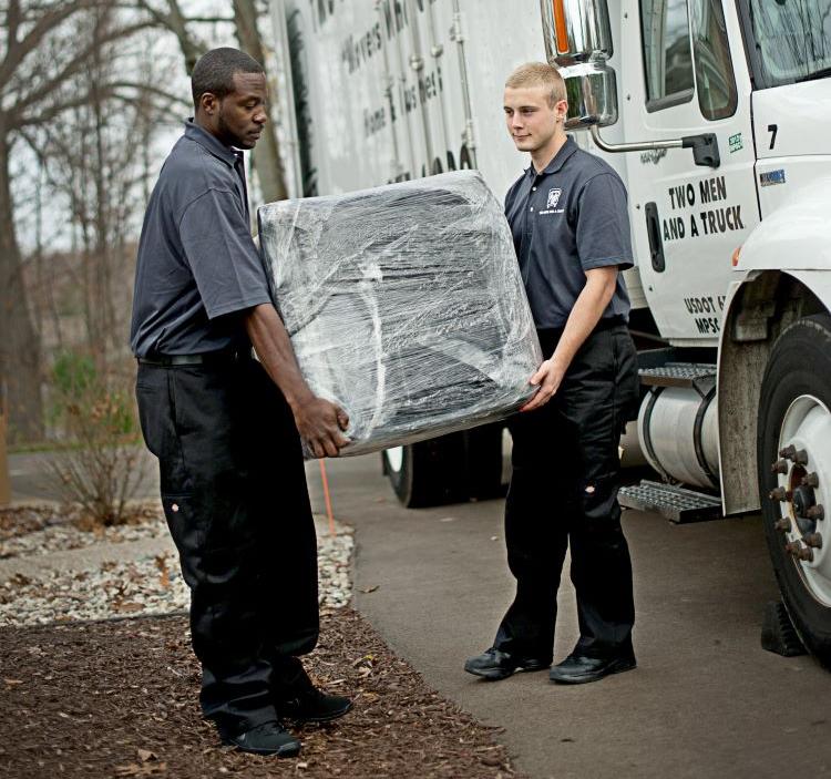 Movers moving a small item